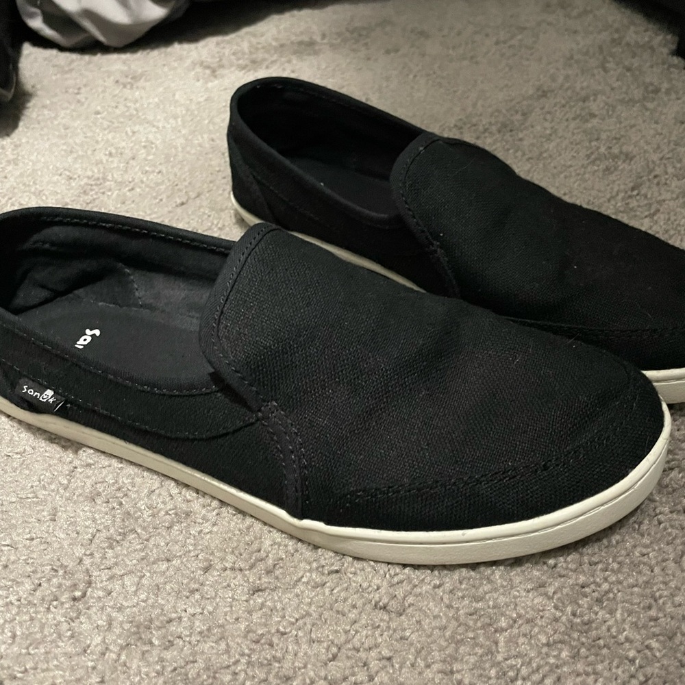 Sanuk black slip ons